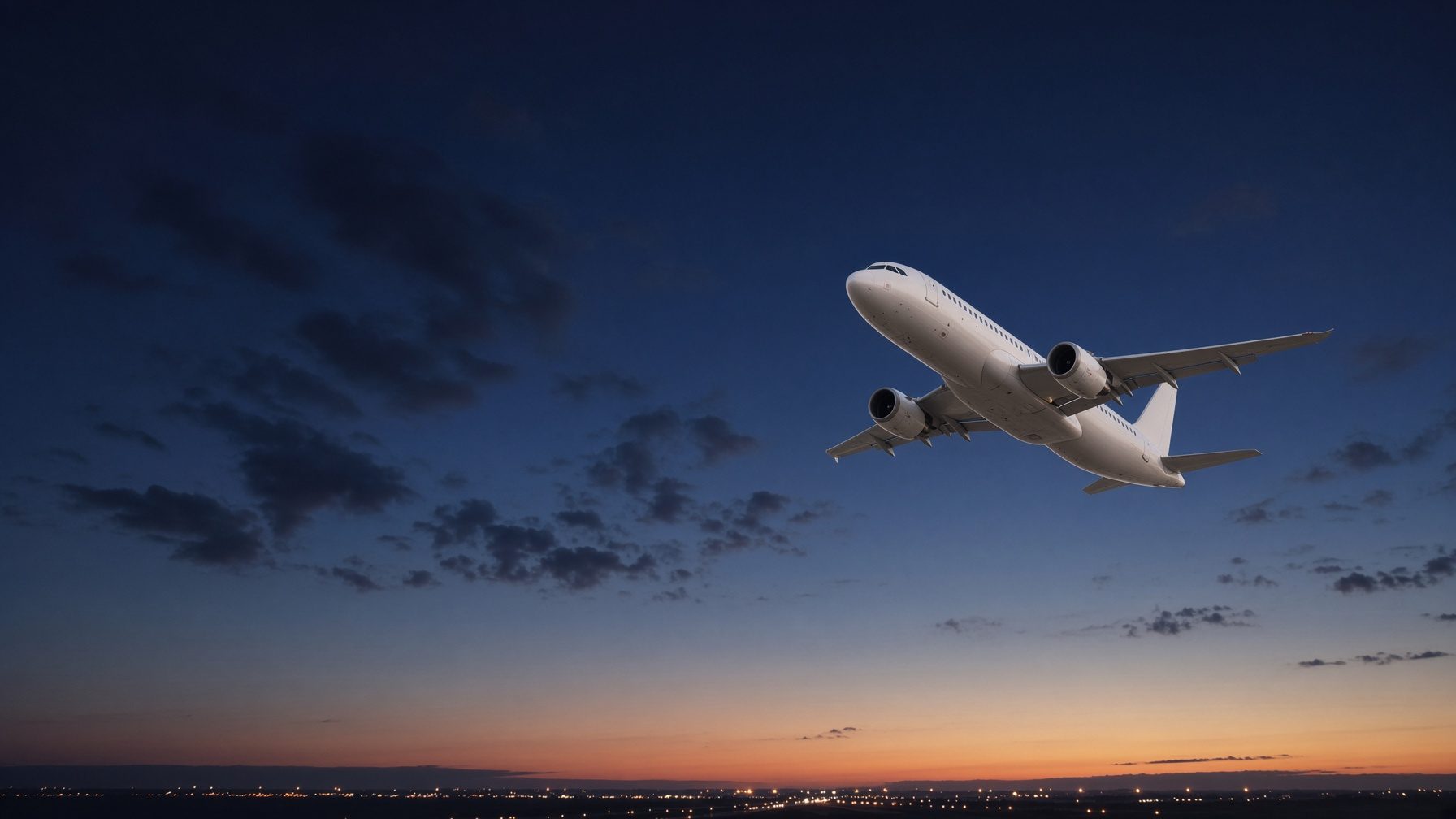 Commercial aircraft climbing after take-off at dusk